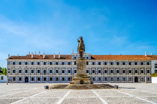 Long facade of the Ducal Palace in Vila Viçosa, with the equestrian statue in the square