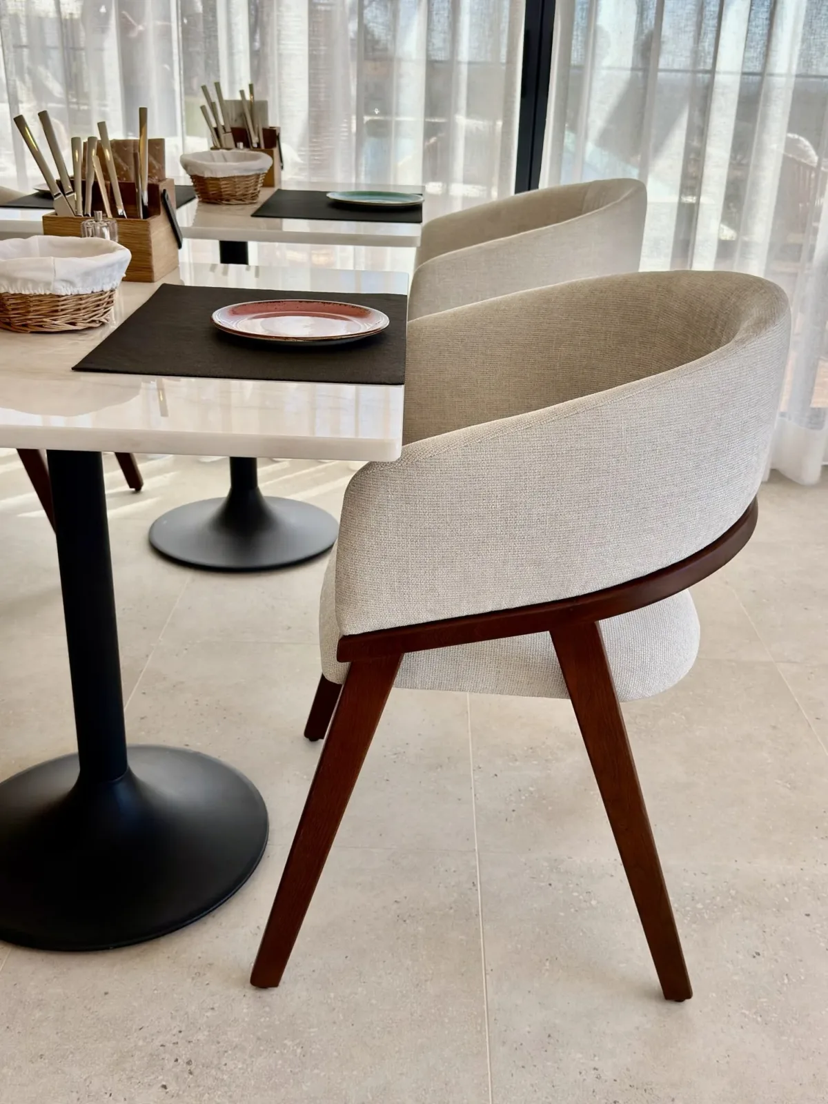 Breakfast table set with ceramic plates