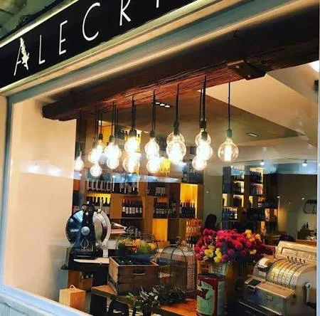 Window of the Alecrim restaurant with pendant bulbs over the dining room