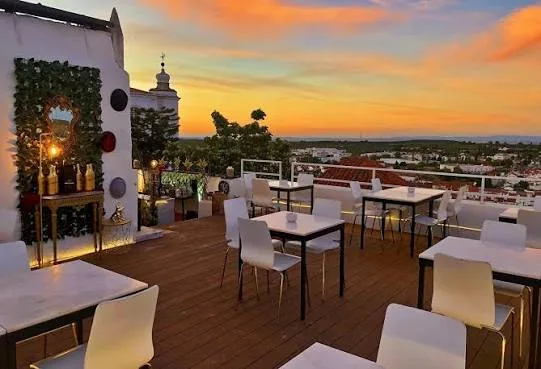 Rooftop terrace at Cadeia Quinhentista at sunset, with a view over the town
